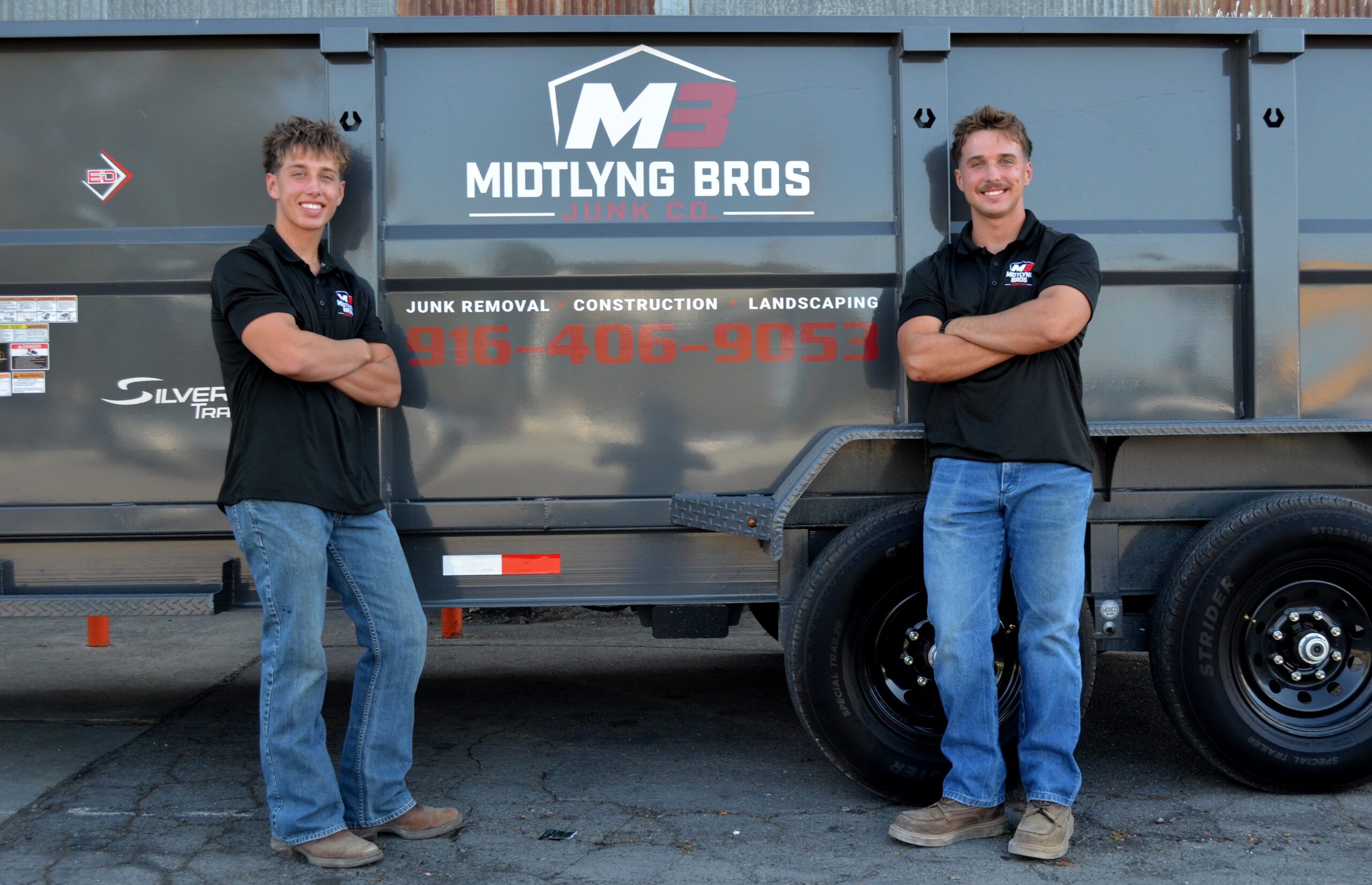 Tommy and Johnny Midtlyng in front of the Midtlyng Bros trailer